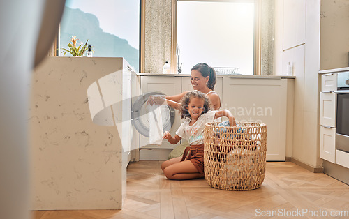 Image of Cleaning, teamwork and washing machine with mother and daughter for helping, learning and cleaner. Housekeeping, laundry and basket with woman and young girl in family home for teaching and clothes