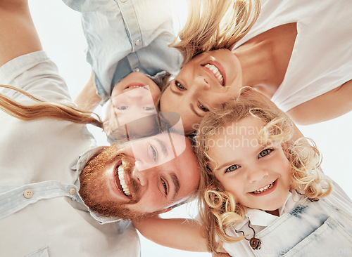 Image of Family portrait, heads together in circle from below and happiness, bonding and holiday travel to Australia. Face of mother, father and children with smile, happy outdoor huddle on summer vacation.