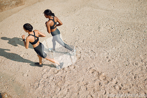 Image of Fitness friends run on the beach, women workout together with cardio and active lifestyle outdoor. Exercise in nature, healthy and top view of female people training with running and mockup space