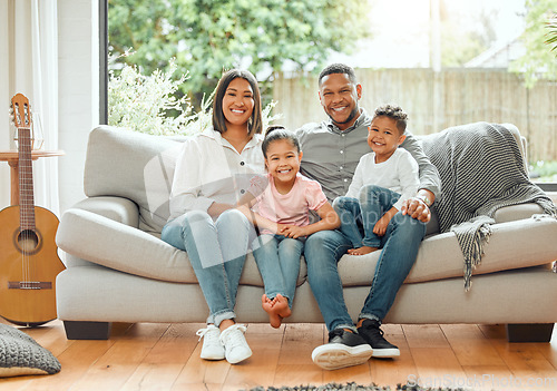 Image of Family in portrait, parents and children smile, relax on couch with happiness and love while at home. Bonding, care and happy relationship, people together in house living room with mom, dad and kids