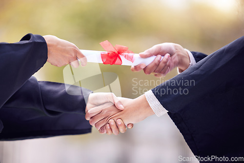 Image of Giving, diploma and people handshake in graduation success, congratulations or thank you. University students, graduate or person shaking hands for certificate, award and scholarship event in closeup