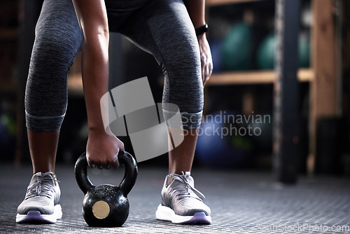 Image of Fitness, kettlebell or hands of woman in training, workout or bodybuilding exercise for grip strength or power. Body builder, arms closeup or strong athlete at gym to start lifting heavy weights