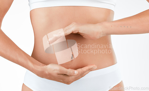 Image of Stomach, wellness and hands of woman in studio for digestion, gut or health on white background. Abdomen, detox and lady person with finger shape for healthy, balance or weight loss, control or diet