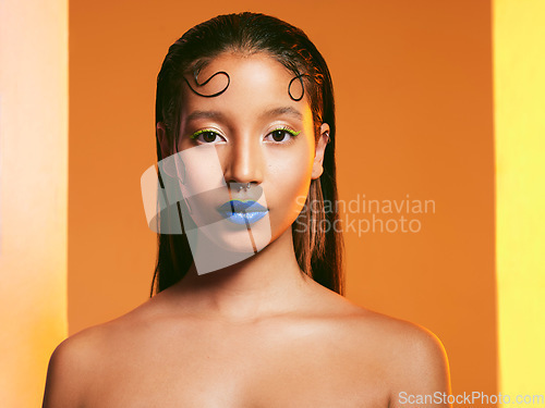 Image of Makeup, blue lipstick and portrait of woman in studio for cosmetics, eye shadow and beauty with color. Creative, cosmetics and face of female person on yellow background for glamour, fashion or style