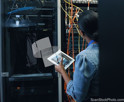 Image of Server room, engineer and woman with a tablet for programming, cybersecurity or cable maintenance. Black female technician or IT in datacenter for network, software system upgrade with technology