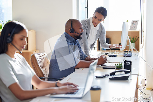 Image of Call center, crm or support with a manager and consultant at work in an office for assistance. Contact us, customer service or consulting with hr management training an employee in telemarketing