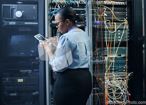 Image of Server room, woman and engineer with tablet for cybersecurity, programming or cable maintenance. Black female technician in datacenter for network, software or system upgrade with IT app and internet