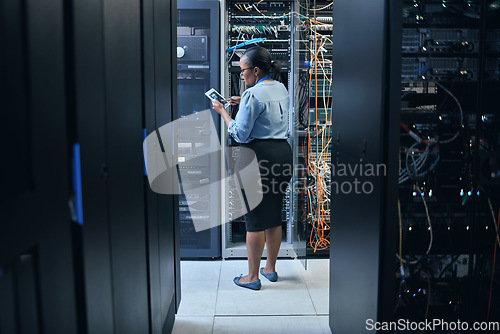 Image of Woman, server room and engineer with a tablet for programming, system upgrade or cable maintenance. Black female technician in datacenter for network, software download or cybersecurity with IT app