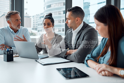 Image of Teamwork discussion, laptop and planning strategy for web tech management, leader presentation or web design in office. Team, business people and corporate meeting for marketing or digital training