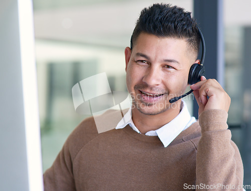 Image of Man in portrait, callcenter with CRM and contact us, communication with headset and phone call in office. Male consultant in customer service, telemarketing or tech support with help desk job