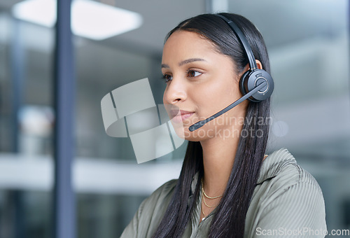 Image of Woman, call center with CRM and contact us, communication with headset and technology in office. Female consultant customer service, telemarketing or tech support with help desk employee at office