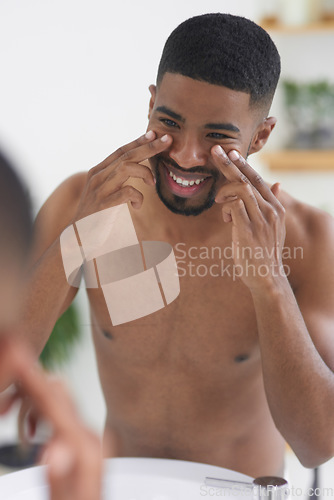 Image of Happy man, face and beauty with mirror and facial, hygiene and grooming during morning routine at home. Male person with smile in bathroom, fresh and clean skincare with wellness and moisturizing