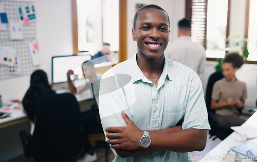 Image of Black man, happy and portrait of designer with arms crossed in office workplace for business. Face, confidence and graphic design, African male person and entrepreneur, professional and leadership.