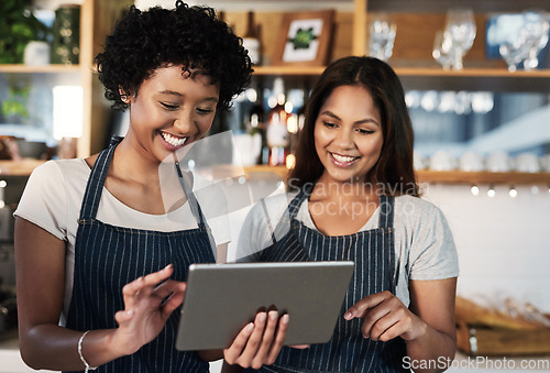 Image of Happy woman, tablet and waitress in teamwork at cafe for inventory, checking stock or orders at restaurant. Barista women or small business team working on technology at coffee shop in online service