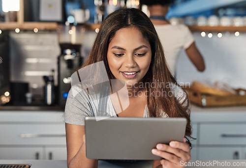 Image of Happy woman, tablet and waitress at cafe for order, inventory or checking stock in management at restaurant. Female person, barista or employee on technology managing small business at coffee shop