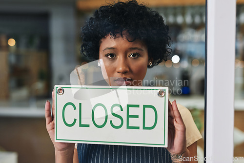 Image of Sad woman, portrait and closed sign on window at cafe in small business, bankruptcy or out of service. Female person or restaurant waitress holding billboard for fail or debt at coffee shop or store