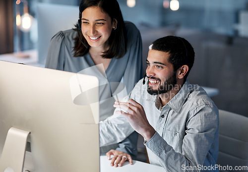 Image of Call center, manager and happy team at computer for software training, customer service and CRM in office. Man, woman and sales mentor helping intern on desktop, telemarketing and technical support