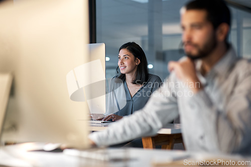 Image of Call center, woman and working at computer for customer service, telemarketing sales and consulting in coworking office. Female agent, desktop and communication for advice, questions and CRM at night