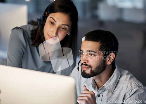 Image of Call center, team leader and computer for customer service, training of software and CRM in office. Focused man, woman and sales mentor helping intern on desktop, technical support and telemarketing