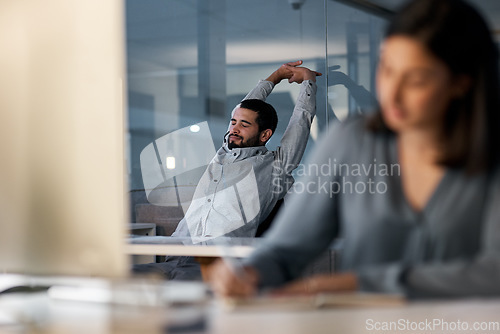 Image of Call center, tired man and stretching at computer desk for telemarketing support in coworking office at night. Lazy, sleepy and frustrated male agent with burnout, fatigue and bored of consulting