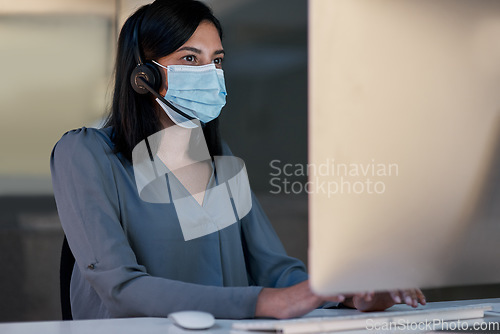 Image of Call center, woman and face mask at computer for customer service, telemarketing sales and CRM consulting in office. Female agent, desktop and covid safety for online telecom advice, support and help