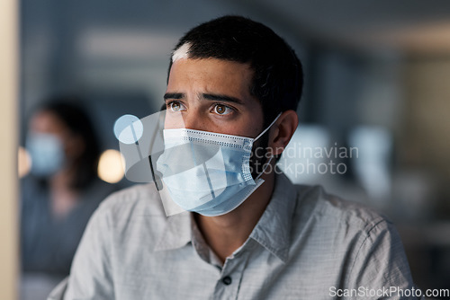 Image of Call center, stress and man with mask at computer for customer service, telemarketing and CRM consulting. Worried male agent, face and virus protection for telecom error, mistake or anxiety in office