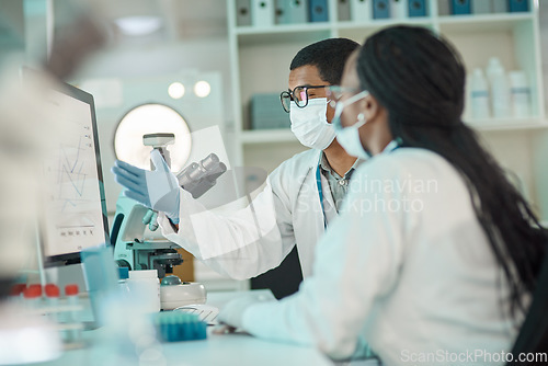 Image of Medical research, scientists working together and planning with computer in a laboratory. Collaboration or teamwork, analysis and professional doctors or researchers discussing data in a lab at work