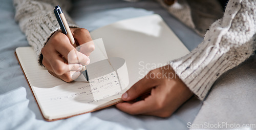 Image of Notebook, bedroom and man hands planning, brainstorming and work from home notes, freelance and reminder. Journal, priority and person in bed for list, planner and schedule or time management goals