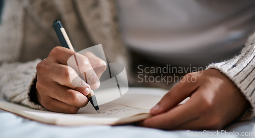 Image of Notebook, bed and person hands for planning, brainstorming and studying notes, education and creativity. Journal, goals and student in bedroom zoom for home learning, plan schedule and reminder