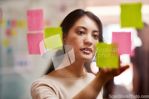 Image of Brainstorming, creative and planning with woman in office for sticky notes, branding and project management. Problem solving, goals and idea with female employee for schedule, solution and moodboard