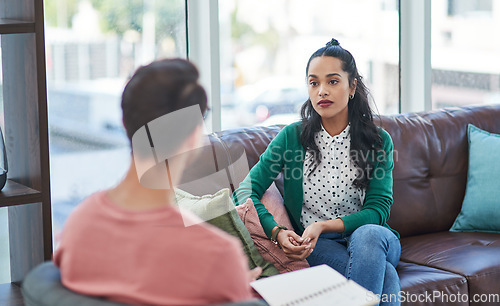 Image of Mental health, therapy or counseling with a man psychologist and female patient talking in his office. Psychology, wellness and trust with a male doctor or therapist consulting a woman for healing