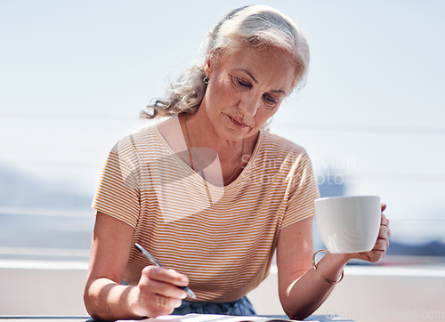 Image of Writing, book and an elderly woman author sitting outdoor in summer for inspiration as a writer. Idea, planning and a female pensioner drinking coffee while using a pen to write in a journal outside