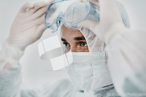 Image of Man with face mask, goggles and safety from Covid, health policy and protection suit with disinfection. Crisis, healthcare compliance and male medical professional in PPE to protect against corona