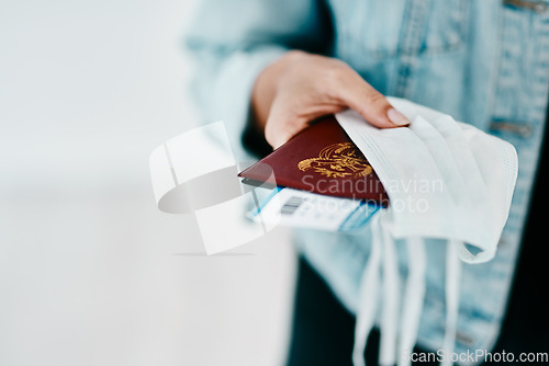 Image of Covid, person and hands with passport, face mask and protection for boarding pass at airport. Closeup, travel and tourists journey of passenger with personal visa for safety, security or safeguarding