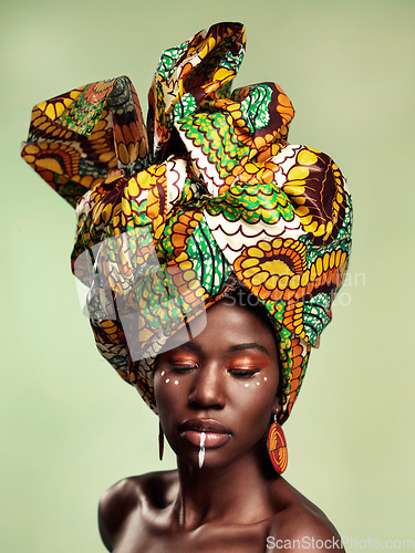 Image of Beauty, black woman and queen makeup with African head wrap and pride with fashion. Isolated, green background and young female person with a traditional hair scarf with confidence and culture