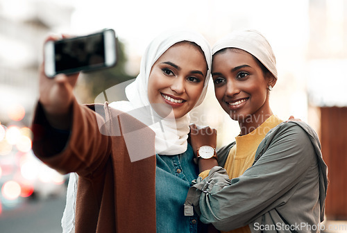 Image of Muslim woman, selfie and social media in city together with happiness, outdoor or urban adventure. Islamic women, profile picture and photography for travel blog, app and friends on road in metro cbd