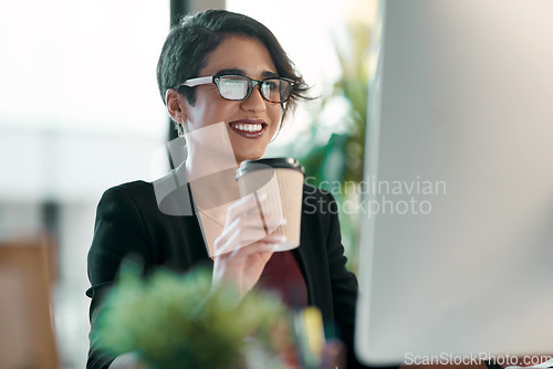 Image of Business woman, happy and computer, coffee and working in office planning, online reading and editing in her office. Inspiration, creative ideas and professional worker or person review on desktop pc