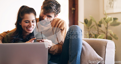 Image of Couple, credit card and laptop for online shopping with virtual wallet, booking or internet payment at home. Love, ecommerce and happy woman with partner for security information or banking on sofa