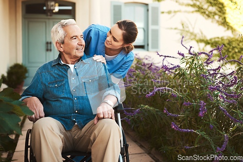 Image of Senior man, nurse and wheelchair in elderly care, talking or healthcare support at nursing home. Happy mature male and woman caregiver walking patient, person with a disability in retirement outdoors