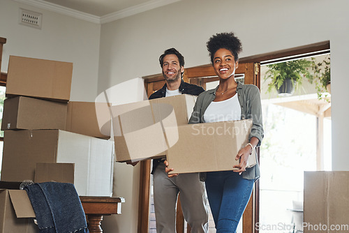 Image of Happy couple, real estate and moving in property with boxes for renovation, investment or relocation. Excited interracial man or woman owner carrying box in move together or mortgage loan in new home