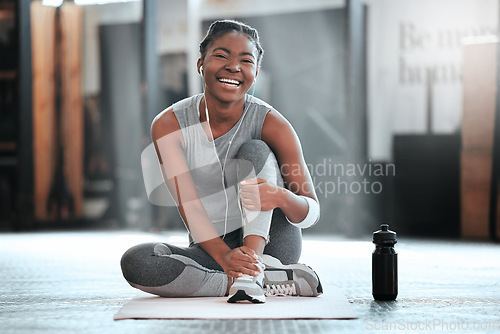 Image of Gym, portrait or happy black woman on break after a workout, exercise or training for fitness. Funny, smile or healthy sports girl or female African athlete smiling or relaxing with positive mindset