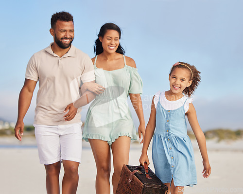 Image of Happy family, parents or girl walking on beach to relax on fun holiday vacation or picnic together. Dad, mom or excited young child bonding, smiling or holding basket outdoors in summer at seashore