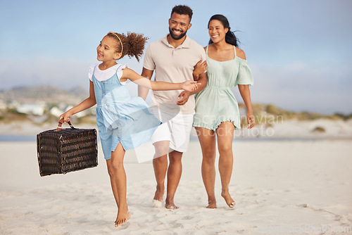 Image of Happy family, parents or child walking on beach to relax on fun holiday vacation or picnic together. Dad, mom or excited young girl bonding, smiling or holding basket outdoors in summer at seashore