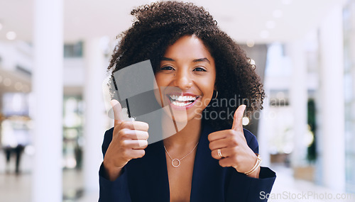 Image of Thumbs up, yes and happy business black woman doing thank you gesture, sign and excited for company success. African, goal and portrait of a corporate or professional employee in agreement with smile