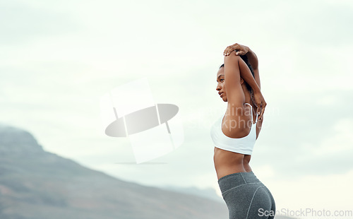 Image of Woman, back stretching and yoga in mountain outdoor for workout and training with mockup. Wellness, nature and warmup with female person doing exercise for health with pilates and relax by a sky