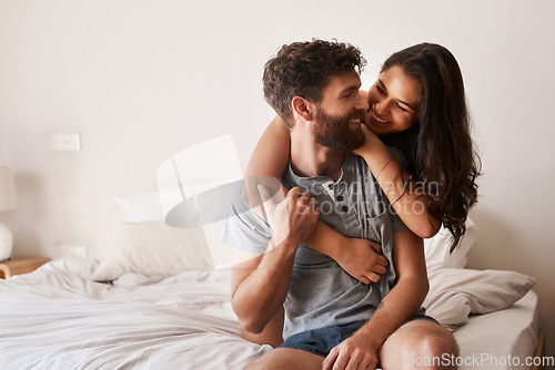 Image of Love, apartment bedroom and happy couple hug, bond and spending relax morning together, bonding and smile. Happiness, home or romantic people embracing with affection, care and quality time on bed