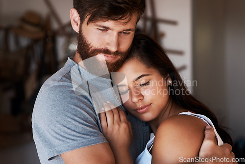 Image of Love, marriage support and couple hug for relationship security, empathy and safety care in home apartment lounge. Intimacy, commitment and romantic man, woman or people hugging with sweet affection