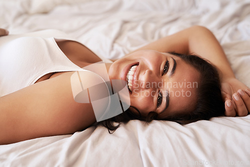 Image of Bedroom portrait, happy and woman relax for morning wellness, weekend laziness or home relaxation. Mental health rest, vacation happiness and face of female person smile on hotel bed in Argentina
