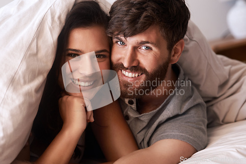 Image of Bed blanket, face and portrait of happy couple, relax and enjoy morning together bonding on Croatia vacation holiday. Happiness, smile and romantic woman, man or people resting in home bedroom