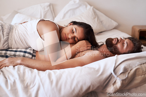 Image of Wellness sleep, bedroom and couple fatigue, burnout and tired in home apartment, dream and relax on bed. Morning rest, peace and exhausted man, woman or people sleeping together with eyes closed